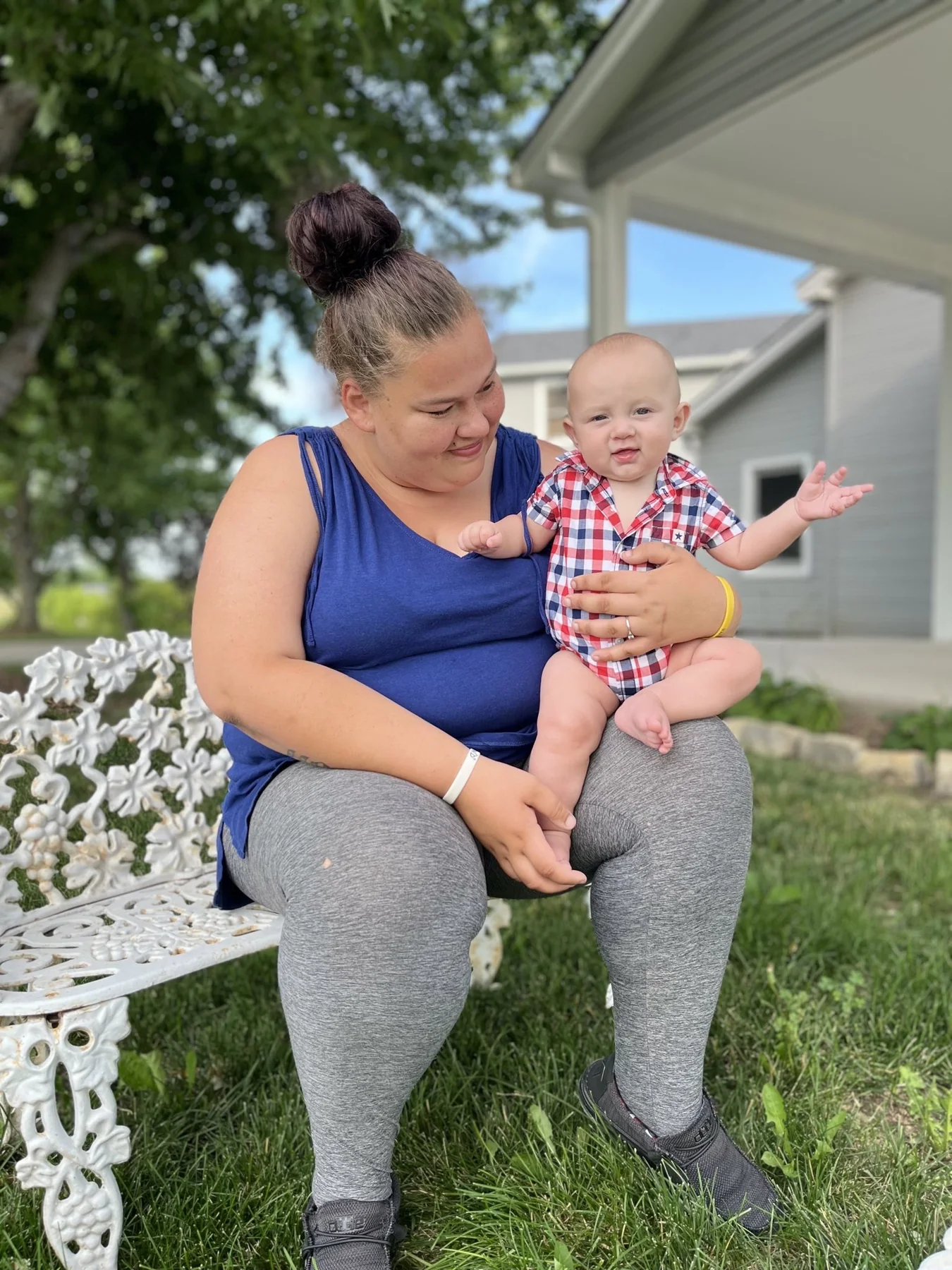 A mother and her baby outside on the grounds