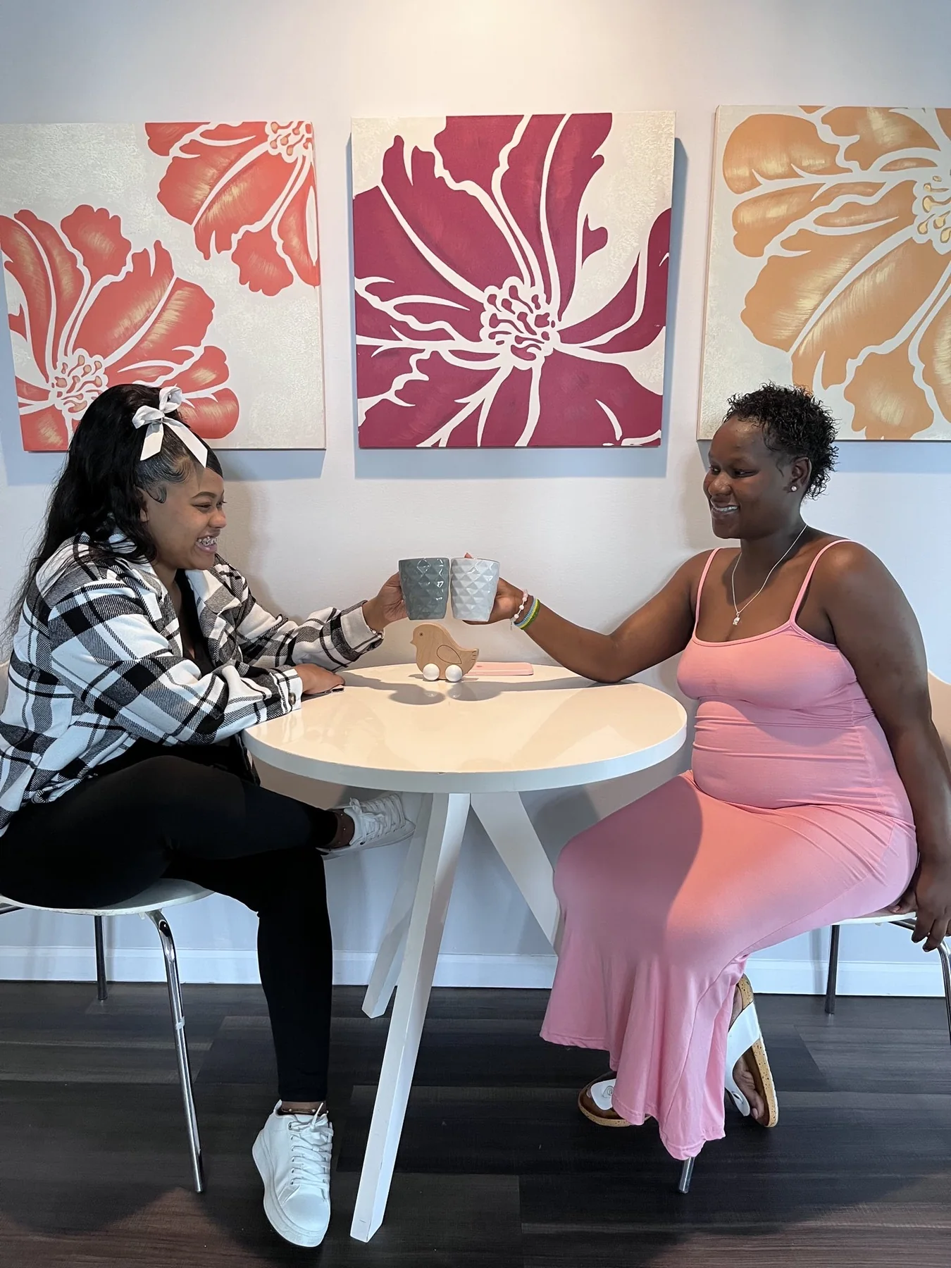 A case manager and a mother talking over coffee